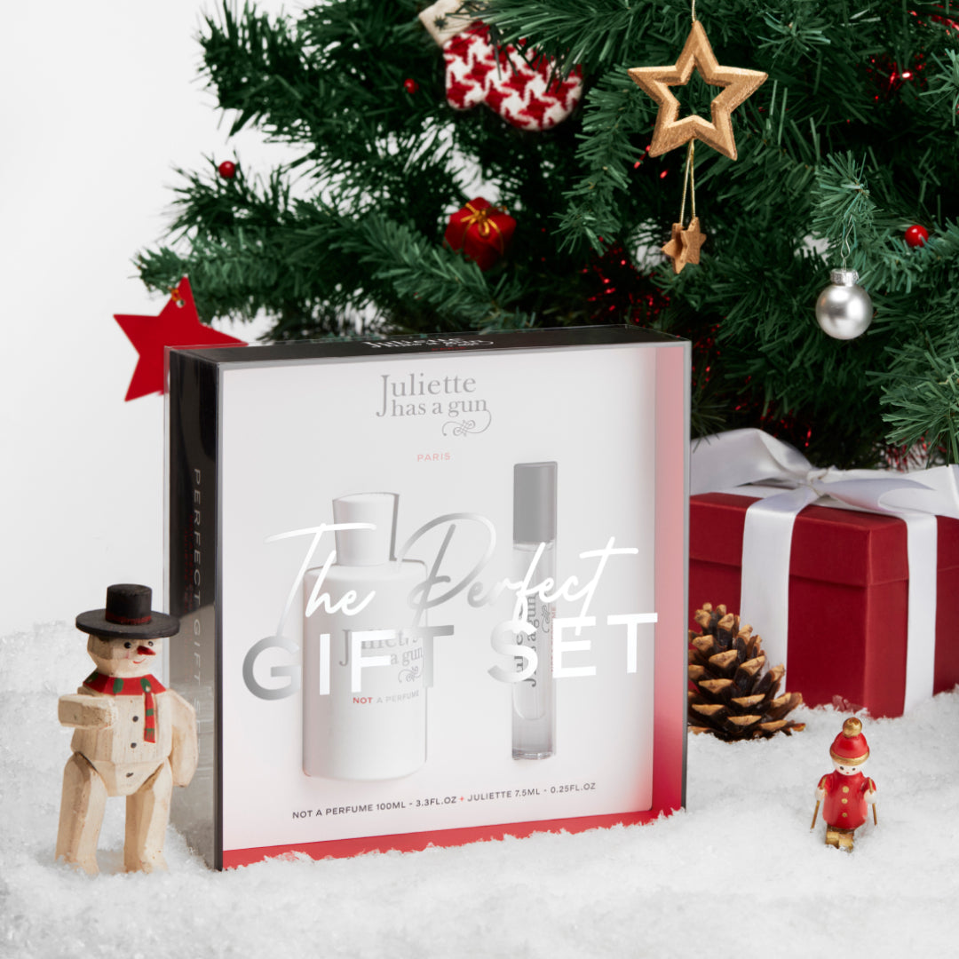 the perfect gift set juliette has a gun under a christmas tree with gifts